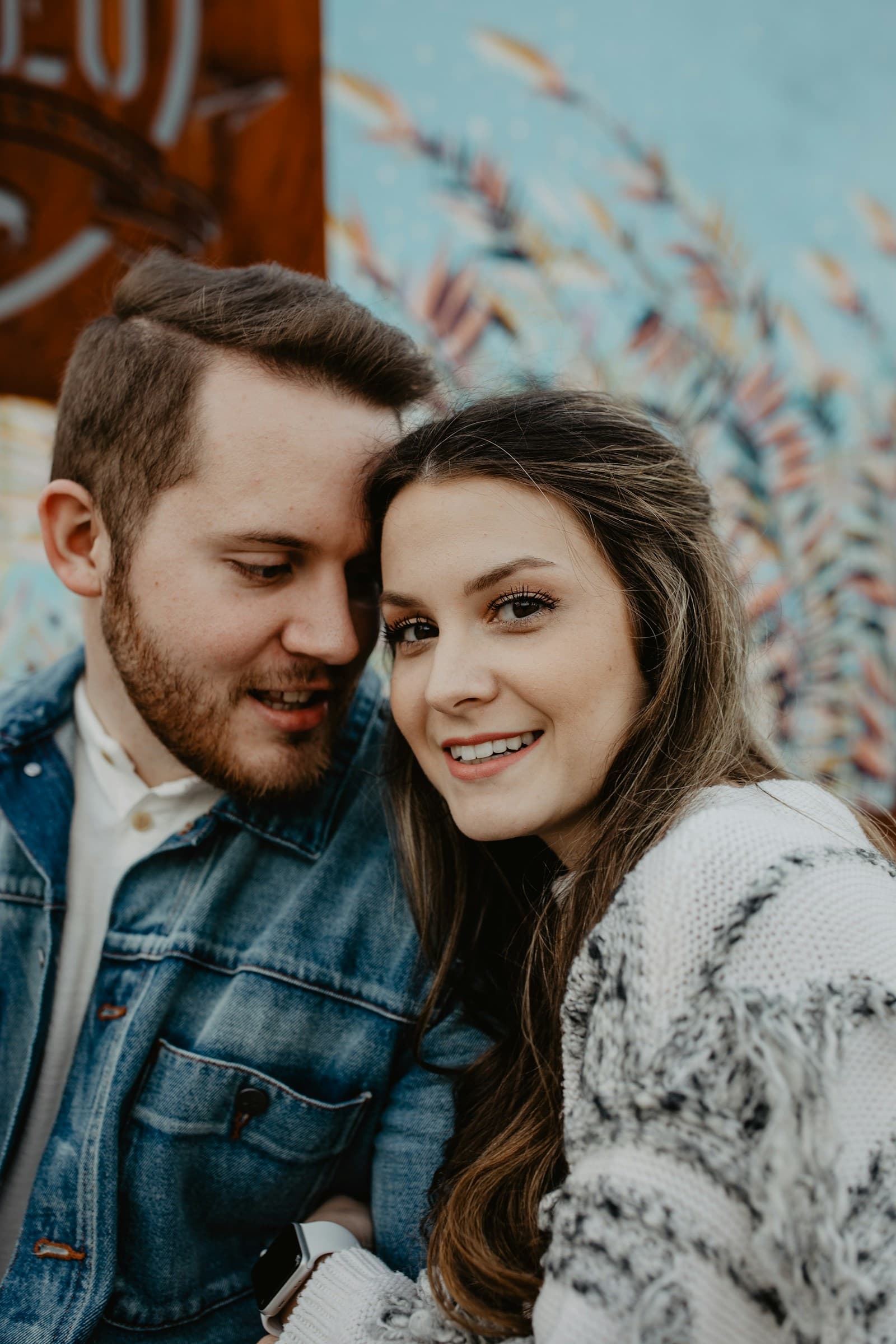 A couple leaning close to one another. Temporary editorial photograph.